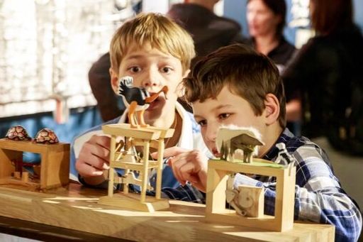 Two boys playing with automata at The MAD Museum